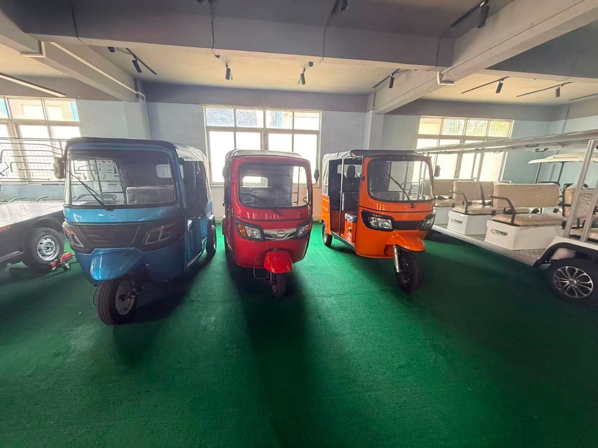 Showroom of electric three-wheelers in multiple colours